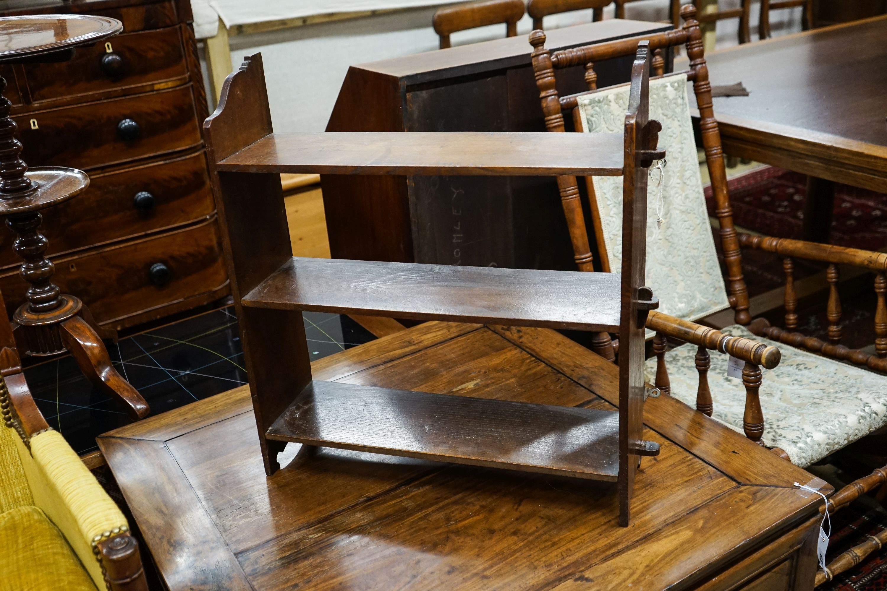 A late Victorian oak wall bracket, caned stool and chair